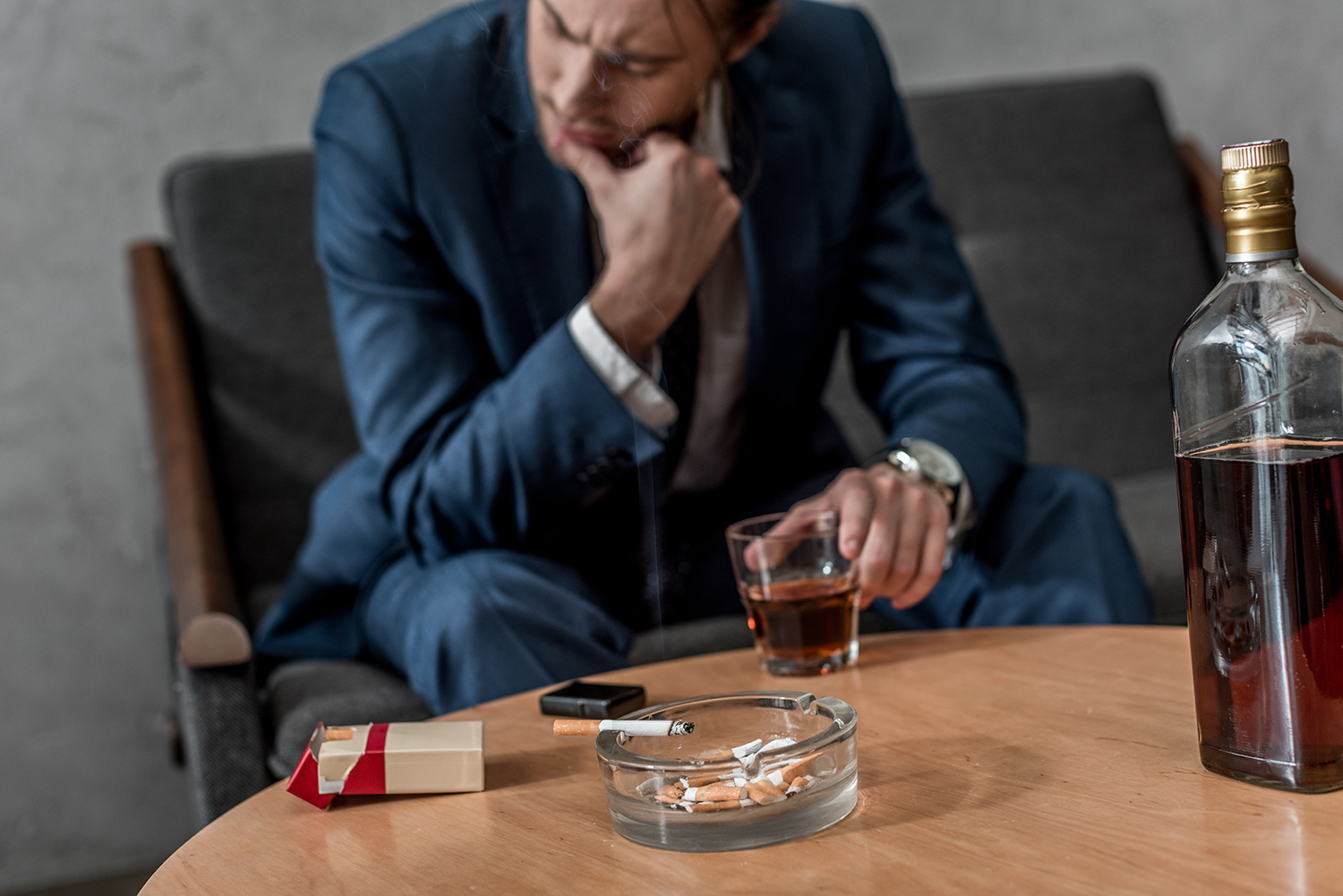 Businessman Drinking at Home.