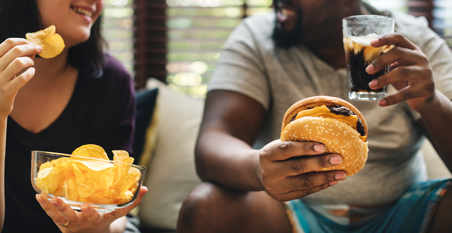 Couple Having Fast Food on the Couch.