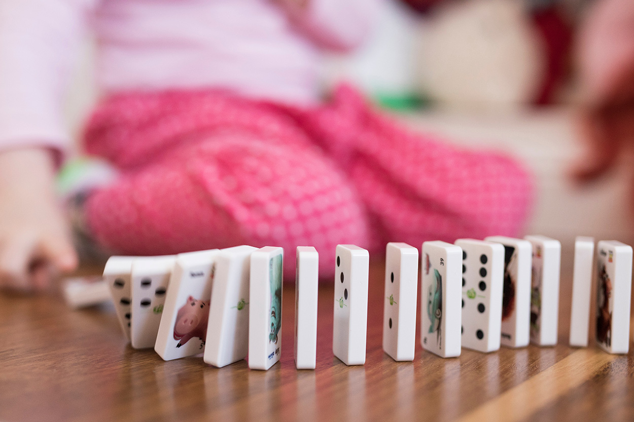 Girl Playing Dominoes.