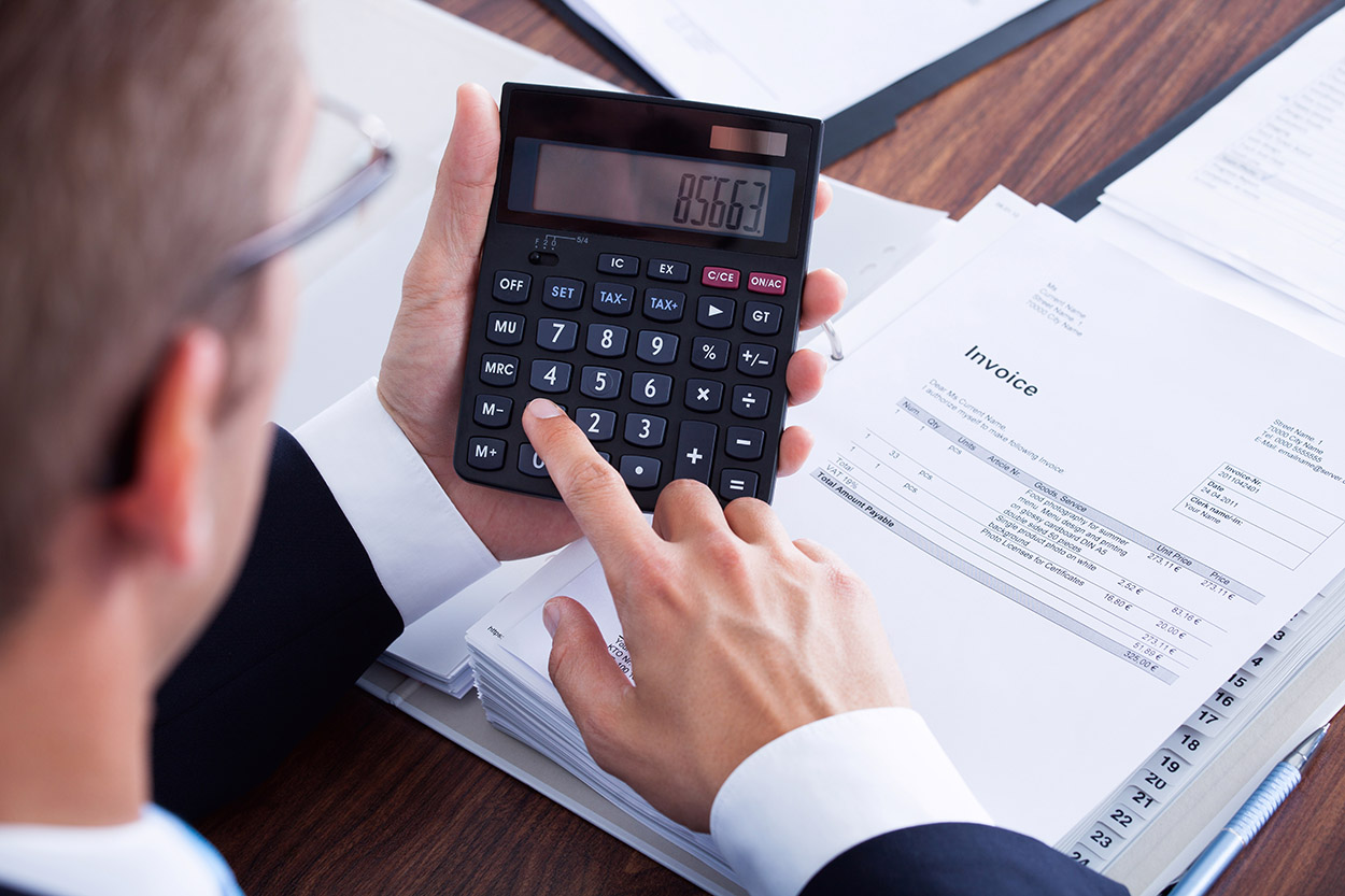 Accountant using calculator