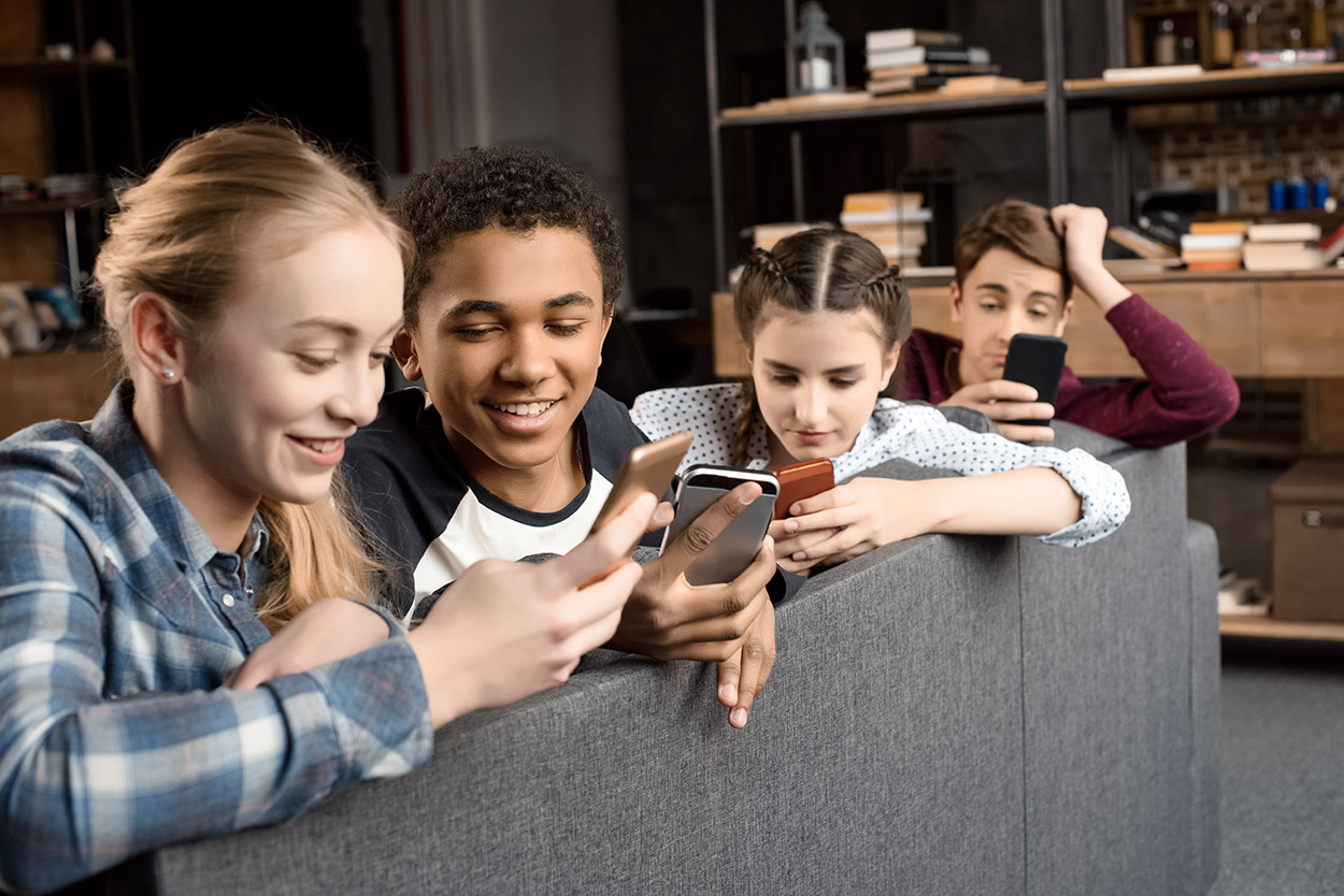 Friends using smartphones