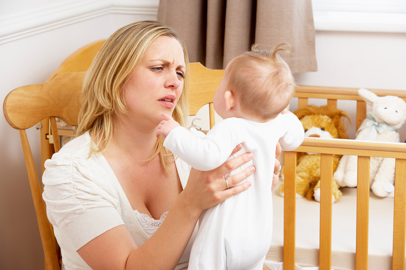 Stressed Mother With Infant Child.