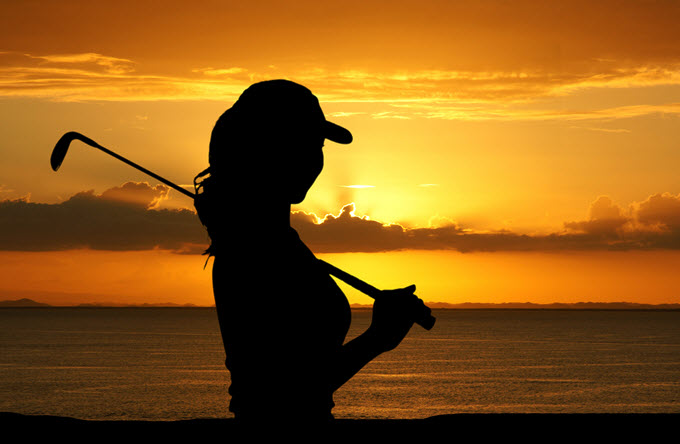 Woman Golfing.